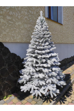 Artificial green cast snow-covered Christmas tree Bukovel 180 cm