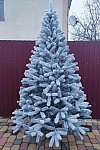 Artificial green cast snow-covered Christmas tree Bukovel 210 cm